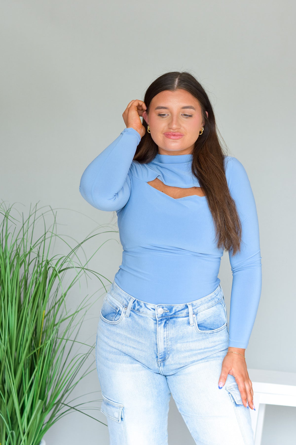 light baby denim blue bodysuit with cut out detail on chest 
