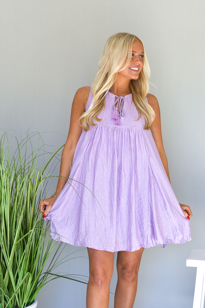 lilac purple swing dress with lace up tie detail at the neckline