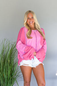 Pink long sleeve crop top with oversized sleeves
