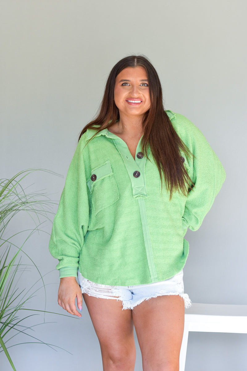 sage green terry knit long sleeve top with an oversized fit