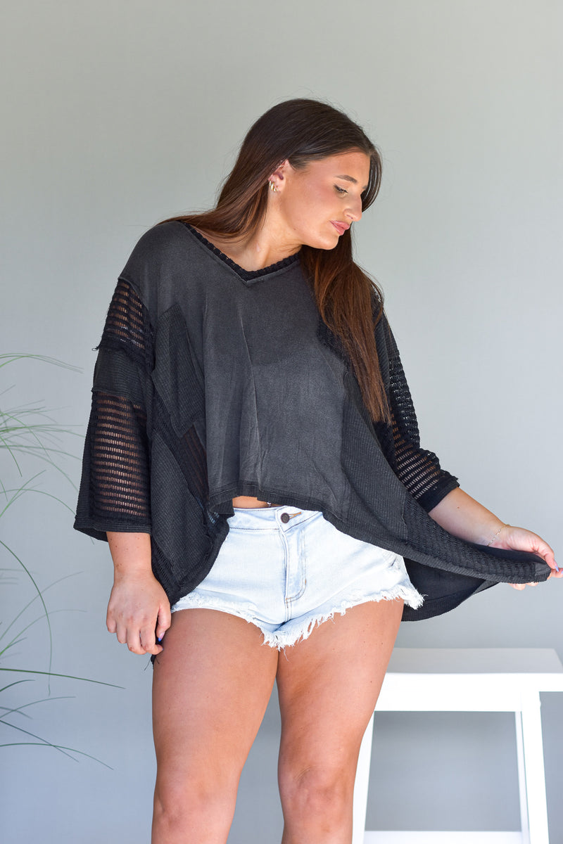 black oversized top with 3/4 length sleeves
