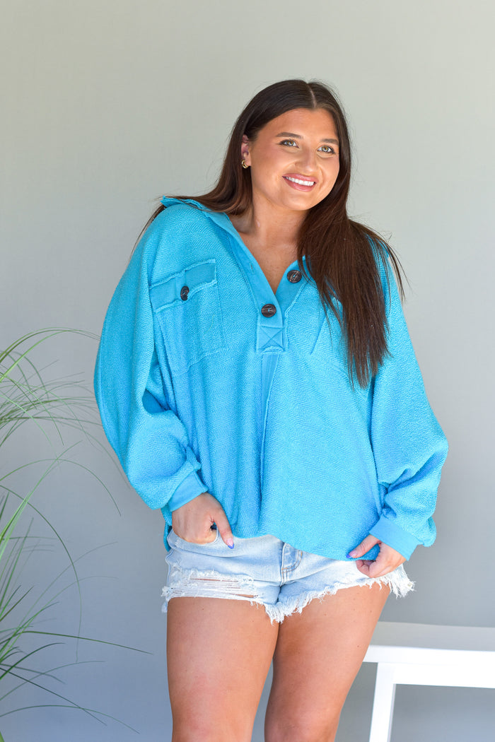 bright blue terry knit top withan oversized fit