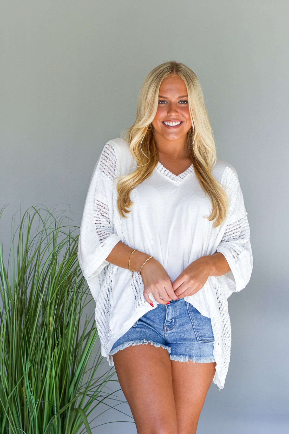 white oversized top with 3/4 length sleeves
