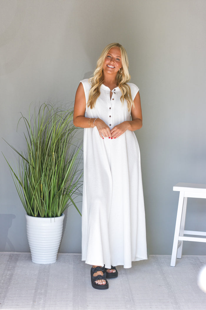 white oversized jumpsuit with a wide flared leg