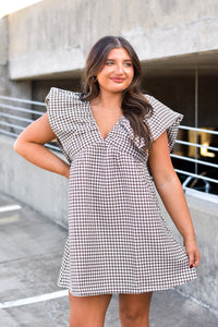 brown and cream houndstooth print dress with ruffle sleeves